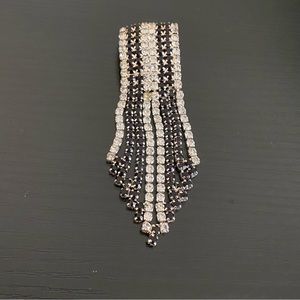 Black and white Rhinestone dangle brooch.